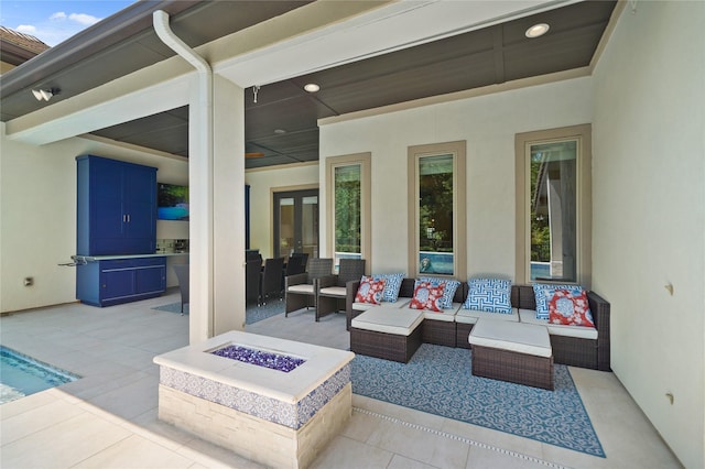 2314 Red Fox Dr, Missouri City, TX 77459 - view of patio featuring an outdoor living space with a fire pit
