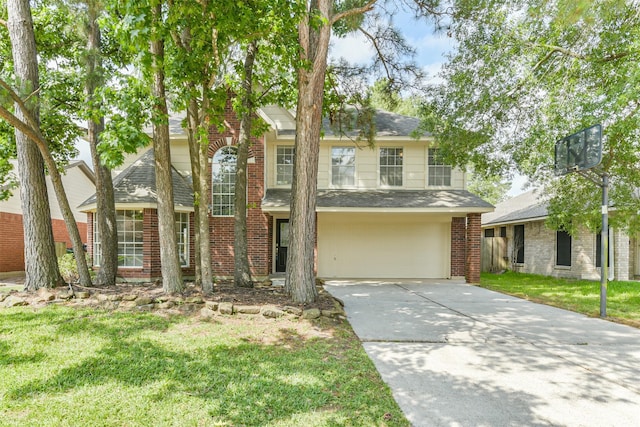 2318 Old Oak Ln, Kingwood, TX 77339 - traditional home with brick siding, driveway, an attached garage, a shingled roof, and a front yard