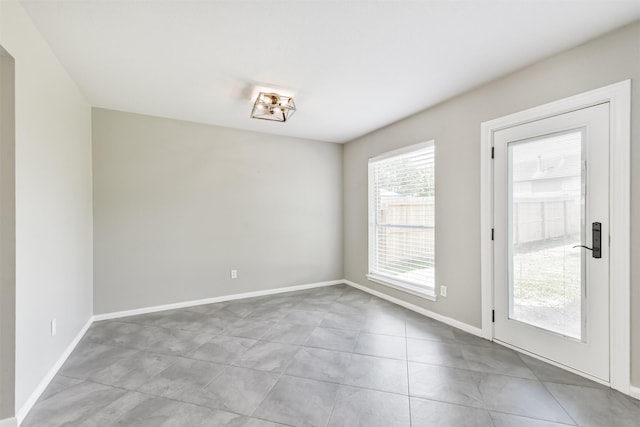 2318 Old Oak Ln, Kingwood, TX 77339 - unfurnished room with tile patterned floors and baseboards