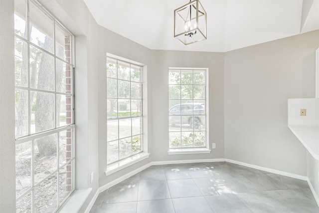 2318 Old Oak Ln, Kingwood, TX 77339 - unfurnished dining area featuring healthy amount of natural light, tile patterned floors, and baseboards