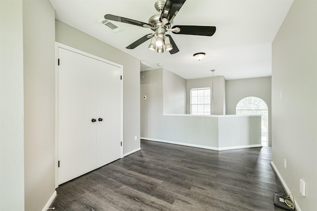 2318 Old Oak Ln, Kingwood, TX 77339 - unfurnished room featuring ceiling fan, wood finished floors, and baseboards