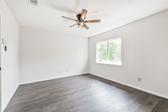 2318 Old Oak Ln, Kingwood, TX 77339 - unfurnished room featuring a ceiling fan, dark wood finished floors, and baseboards