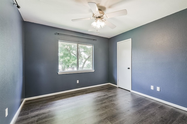 2318 Old Oak Ln, Kingwood, TX 77339 - spare room with wood finished floors, a ceiling fan, and baseboards