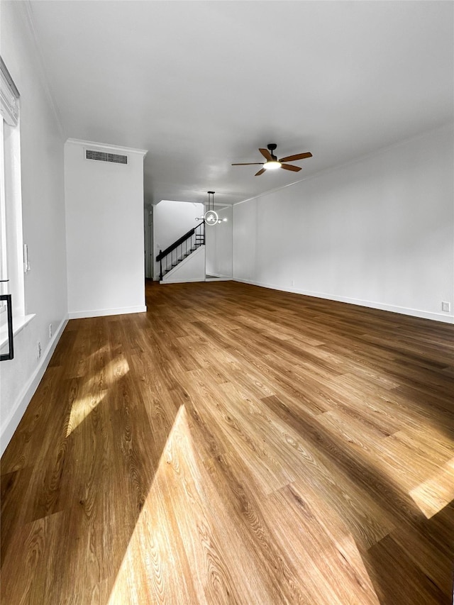 11731 Lakeside Place Dr, Houston, TX 77077 - unfurnished living room with ceiling fan, wood finished floors, and baseboards