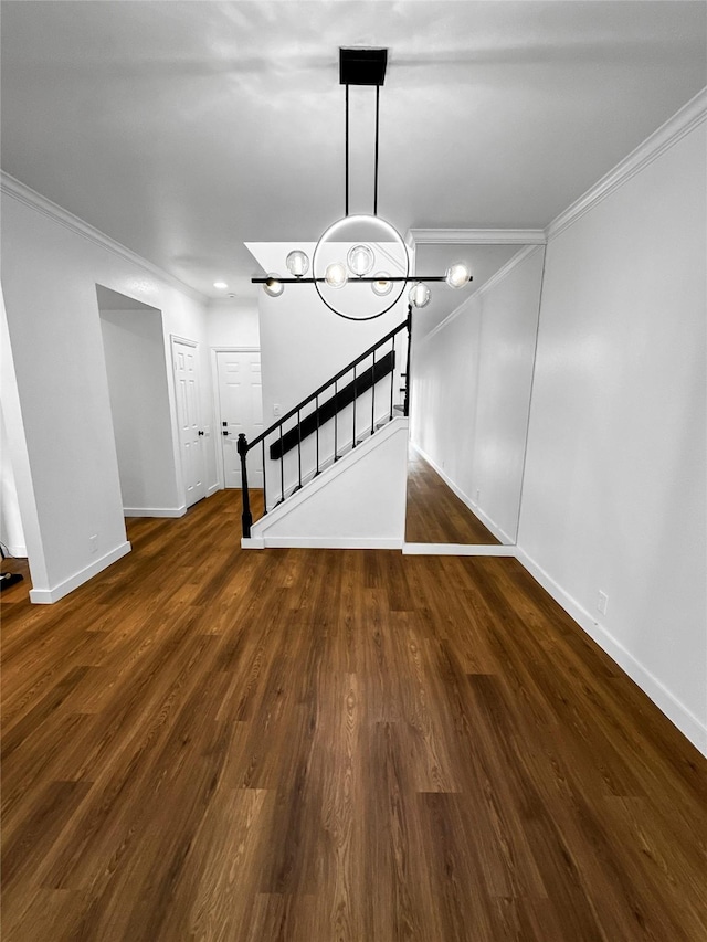 11731 Lakeside Place Dr, Houston, TX 77077 - unfurnished living room featuring crown molding, stairway, a chandelier, baseboards, and wood finished floors