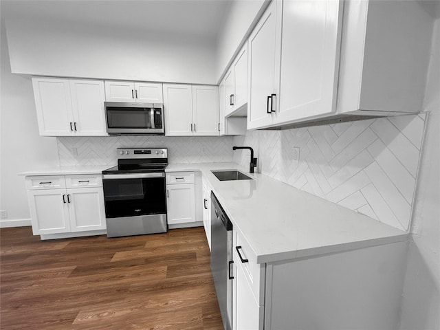 11731 Lakeside Place Dr, Houston, TX 77077 - kitchen with appliances with stainless steel finishes, a sink, white cabinets, and dark wood-type flooring