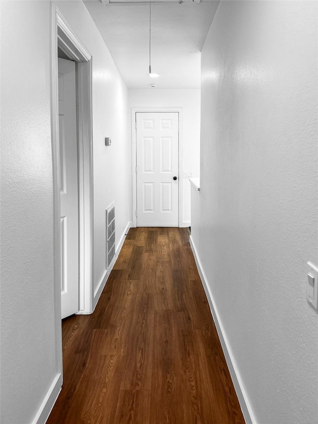 11731 Lakeside Place Dr, Houston, TX 77077 - hallway featuring dark wood-style flooring, baseboards, and attic access