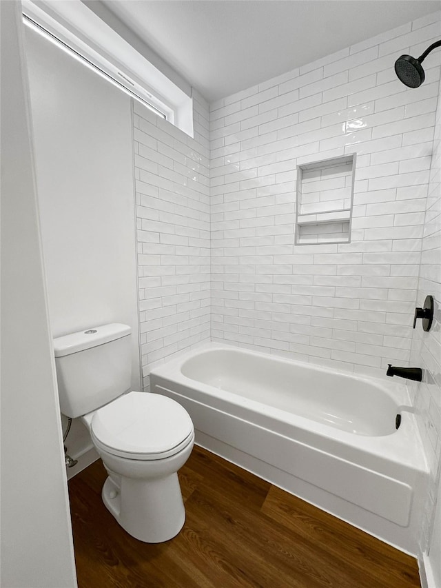 11731 Lakeside Place Dr, Houston, TX 77077 - bathroom with wood finished floors, toilet, and washtub / shower combination