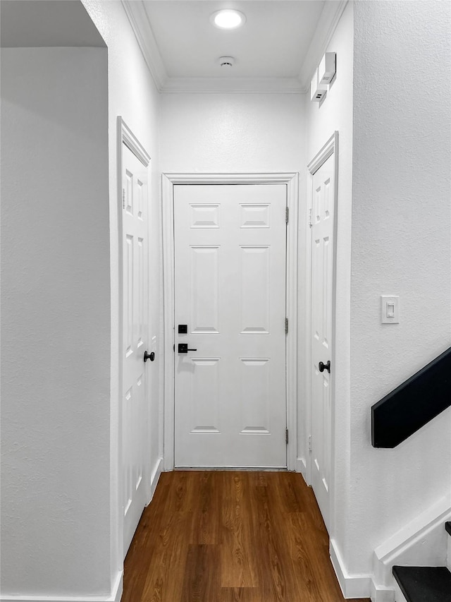 11731 Lakeside Place Dr, Houston, TX 77077 - hallway featuring dark wood-type flooring and ornamental molding