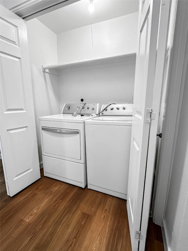 11731 Lakeside Place Dr, Houston, TX 77077 - washroom featuring separate washer and dryer and dark wood finished floors