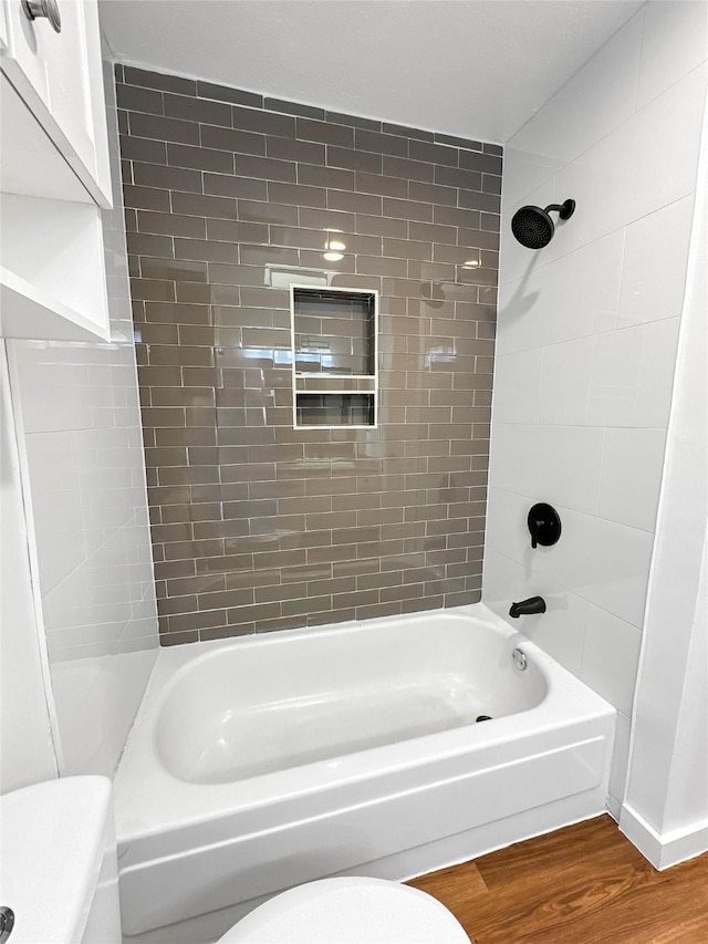 11731 Lakeside Place Dr, Houston, TX 77077 - bathroom featuring toilet, wood finished floors, and  shower combination