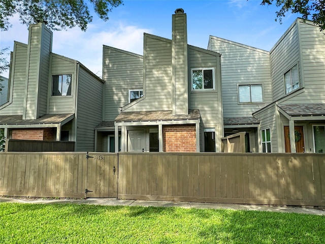 11731 Lakeside Place Dr, Houston, TX 77077 - rear view of property featuring brick siding
