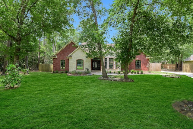 18024 Cindy Ln, Conroe, TX 77302 - view of front of property featuring stone siding