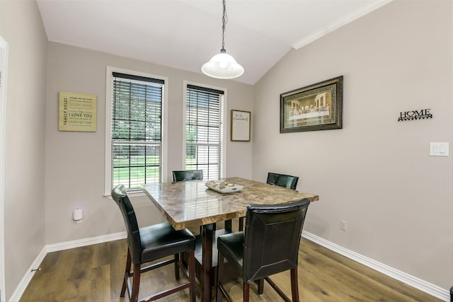 18024 Cindy Ln, Conroe, TX 77302 - dining room featuring baseboards, dark wood-style flooring, lofted ceiling, and ornamental molding