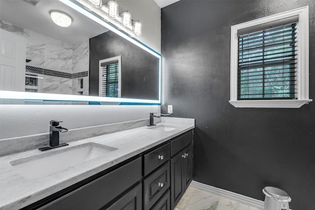 18024 Cindy Ln, Conroe, TX 77302 - full bathroom with marble look tiles, double vanity, tiled shower, baseboards, and a textured wall