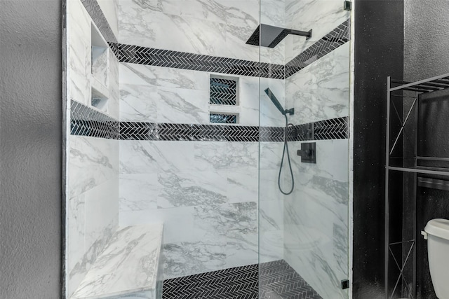 18024 Cindy Ln, Conroe, TX 77302 - full bathroom with a marble finish shower, toilet, and a textured wall