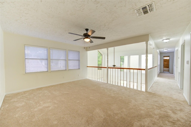 1715 Cobblestone Ct, Richmond, TX 77406 - unfurnished room with a ceiling fan, carpet, a textured ceiling, and baseboards