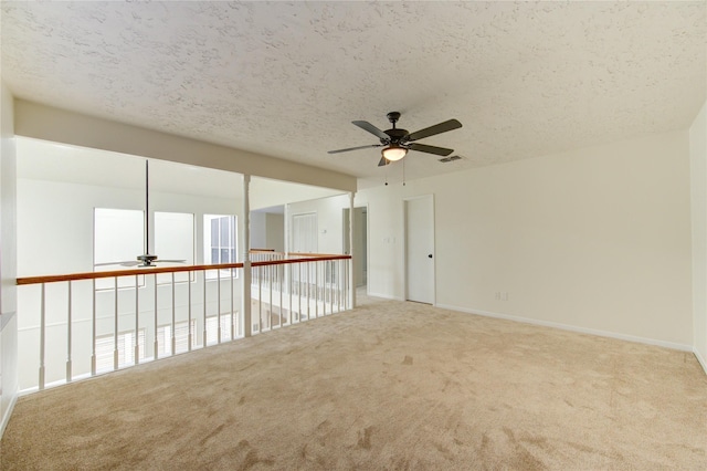1715 Cobblestone Ct, Richmond, TX 77406 - carpeted empty room with ceiling fan, a textured ceiling, and baseboards