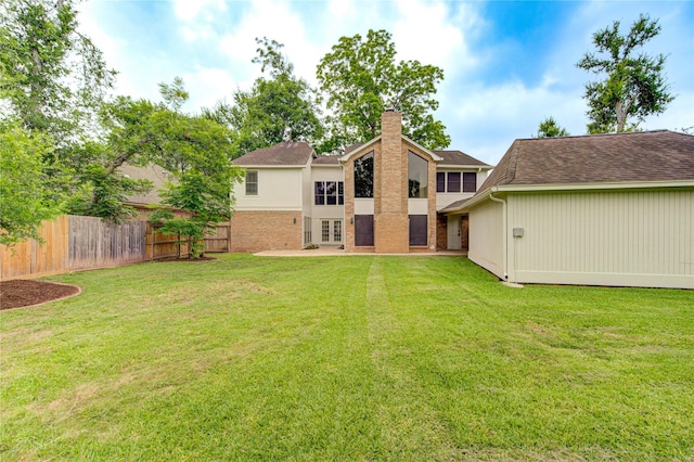 1715 Cobblestone Ct, Richmond, TX 77406 - rear view of house with a chimney, french doors, and a shingled roof