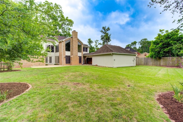 1715 Cobblestone Ct, Richmond, TX 77406 - back of house featuring french doors, a chimney, and brick siding