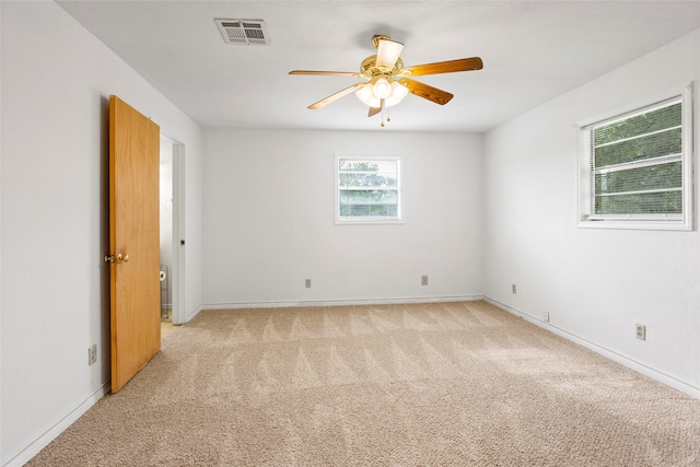 3225 N Jackson St, Santa Fe, TX 77517 - unfurnished room featuring a ceiling fan, light colored carpet, and baseboards