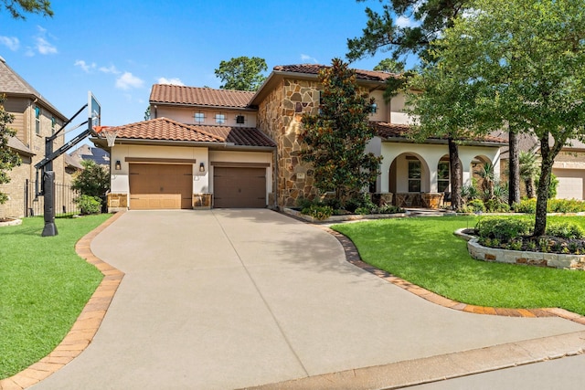 82 Valera Ridge Dr, Spring, TX 77389 - mediterranean / spanish-style home with stucco siding, stone siding, a tiled roof, and driveway