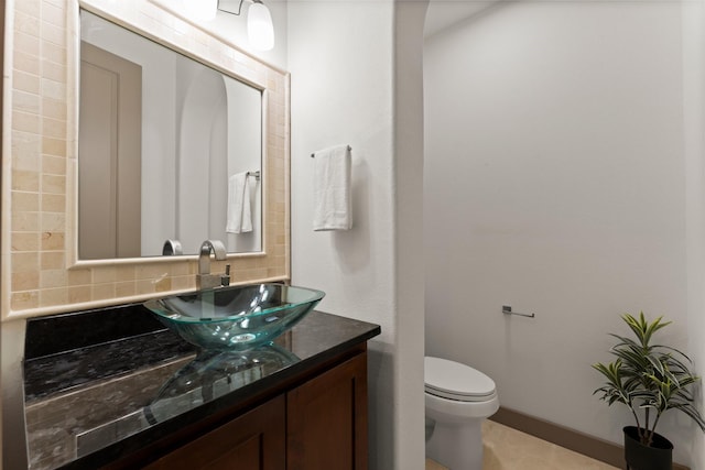 82 Valera Ridge Dr, Spring, TX 77389 - half bathroom featuring decorative backsplash, vanity, and toilet