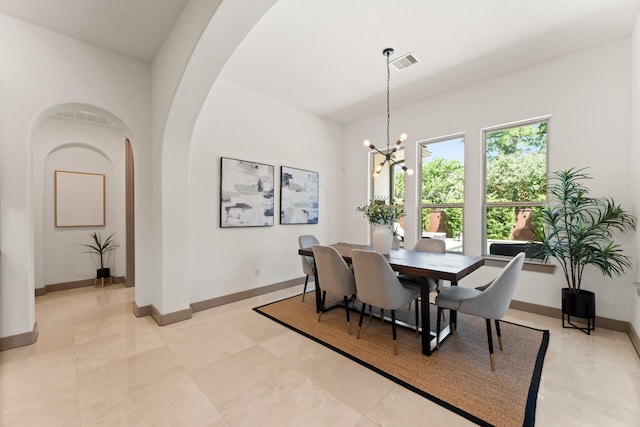 82 Valera Ridge Dr, Spring, TX 77389 - dining space with a chandelier, arched walkways, and baseboards