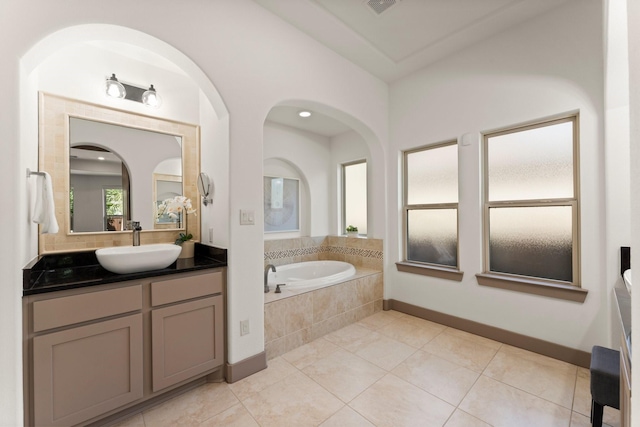 82 Valera Ridge Dr, Spring, TX 77389 - bathroom with vanity, a garden tub, tile patterned flooring, and baseboards