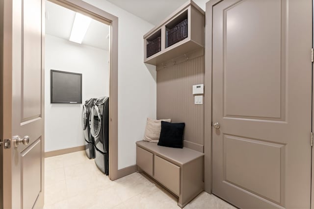 82 Valera Ridge Dr, Spring, TX 77389 - laundry room with washer and dryer, baseboards, and light tile patterned floors