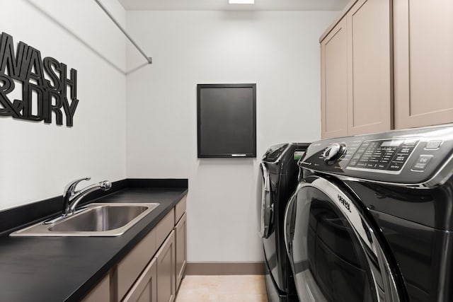82 Valera Ridge Dr, Spring, TX 77389 - laundry area with independent washer and dryer, cabinet space, and baseboards