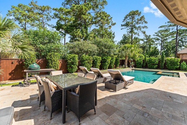 82 Valera Ridge Dr, Spring, TX 77389 - view of swimming pool with a patio, a fenced backyard, a pool with connected hot tub, and outdoor dining space