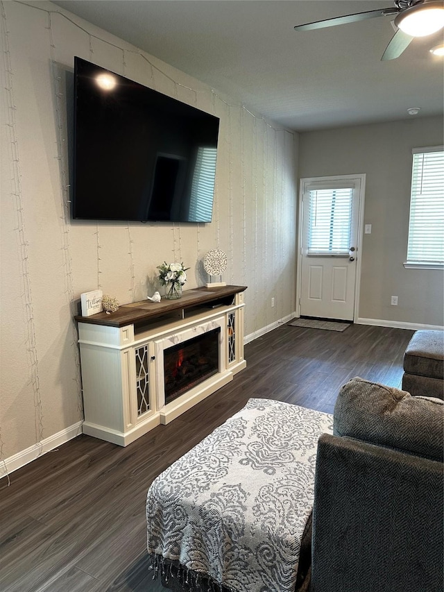 13556 Bowfin Dr, Conroe, TX 77384 - living area featuring dark wood-type flooring, ceiling fan, and baseboards