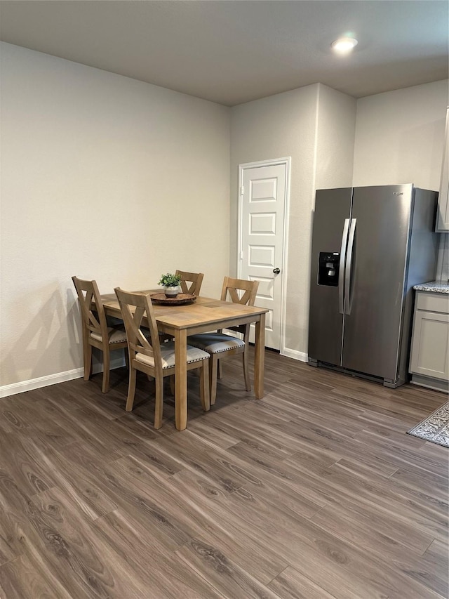 13556 Bowfin Dr, Conroe, TX 77384 - dining room with dark wood-type flooring, baseboards, and recessed lighting