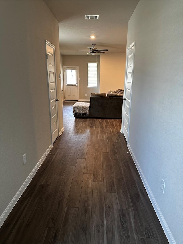 13556 Bowfin Dr, Conroe, TX 77384 - hall with dark wood-type flooring and baseboards