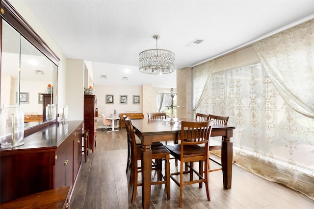 8219 Magnolia Glen Dr, Humble, TX 77346 - dining space featuring a chandelier and wood finished floors