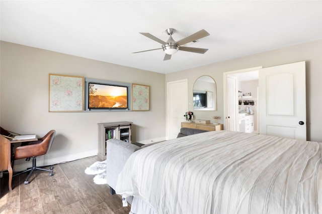 8219 Magnolia Glen Dr, Humble, TX 77346 - bedroom with baseboards, wood finished floors, and a ceiling fan