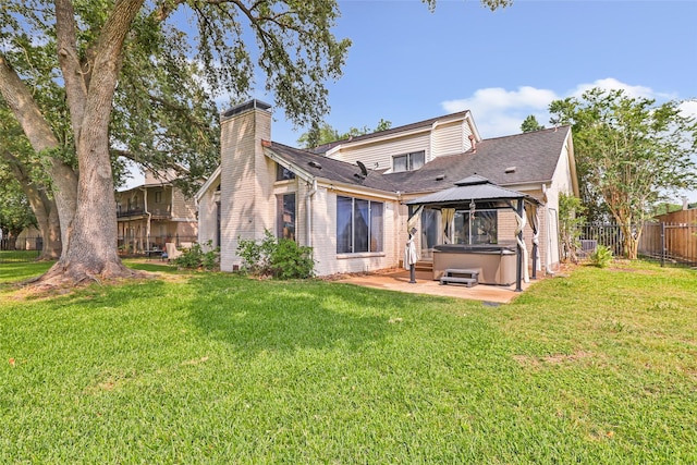 8219 Magnolia Glen Dr, Humble, TX 77346 - rear view of property with a hot tub, a gazebo, a chimney, a patio area, and roof with shingles