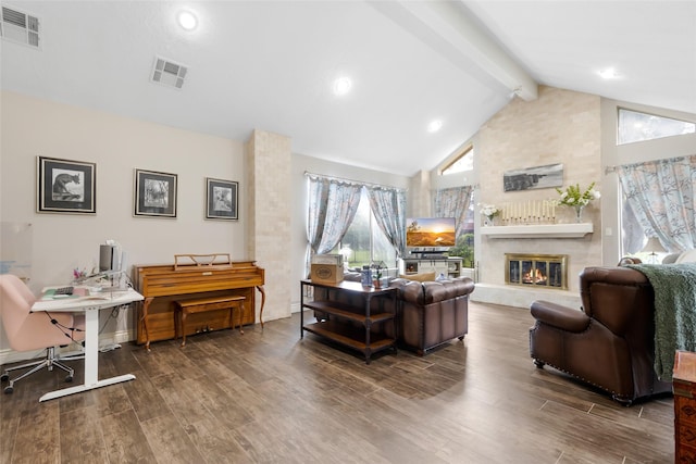 8219 Magnolia Glen Dr, Humble, TX 77346 - living room featuring beamed ceiling, wood finished floors, high vaulted ceiling, and a large fireplace