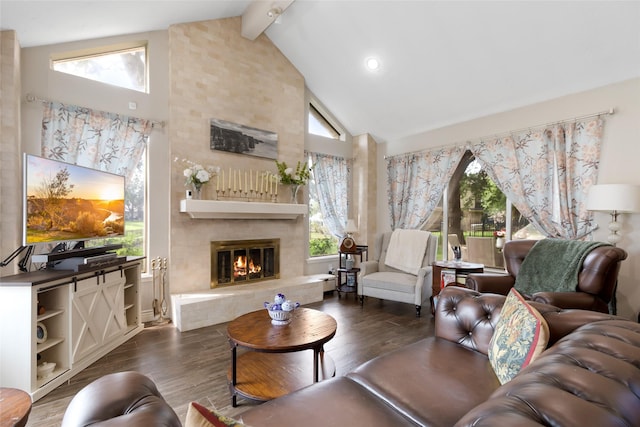 8219 Magnolia Glen Dr, Humble, TX 77346 - living area with high vaulted ceiling, wood finished floors, a large fireplace, and beam ceiling