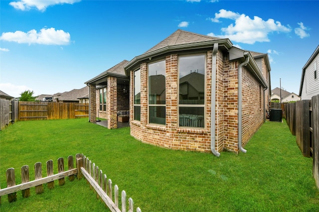 23619 Bottlebrush Terrace Trl, Katy, TX 77493 - view of side of property with brick siding, central air condition unit, and roof with shingles
