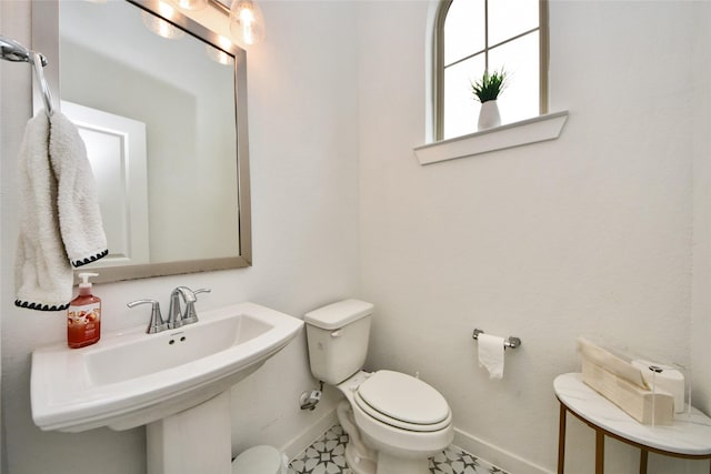 23619 Bottlebrush Terrace Trl, Katy, TX 77493 - half bathroom featuring toilet, baseboards, and a sink