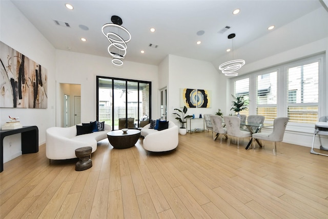 23619 Bottlebrush Terrace Trl, Katy, TX 77493 - living area with plenty of natural light, light wood-style floors, a chandelier, and recessed lighting