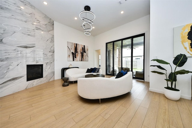 23619 Bottlebrush Terrace Trl, Katy, TX 77493 - living room with wood finished floors, a fireplace, and recessed lighting