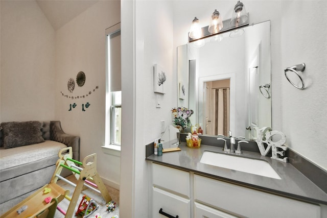23619 Bottlebrush Terrace Trl, Katy, TX 77493 - bathroom with vanity, lofted ceiling, and baseboards