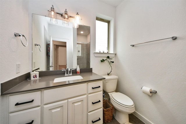 23619 Bottlebrush Terrace Trl, Katy, TX 77493 - full bathroom featuring vanity, a tile shower, toilet, and baseboards