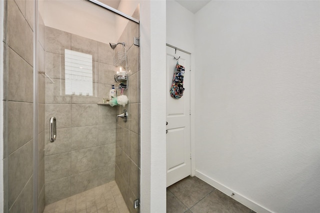 23619 Bottlebrush Terrace Trl, Katy, TX 77493 - bathroom with a shower stall, baseboards, and tile patterned floors