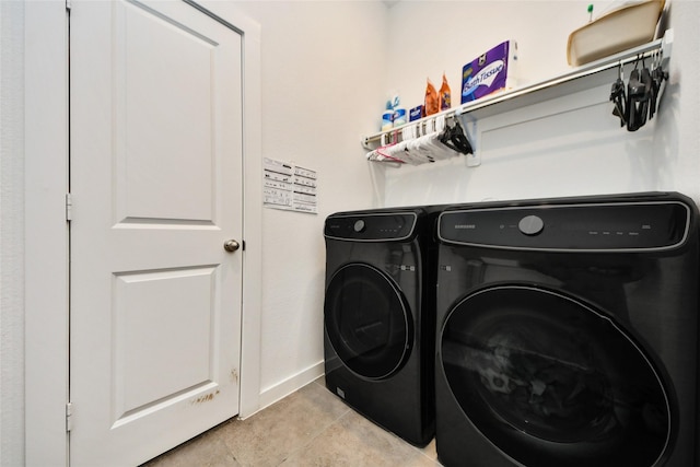 23619 Bottlebrush Terrace Trl, Katy, TX 77493 - laundry area with independent washer and dryer, baseboards, and light tile patterned floors