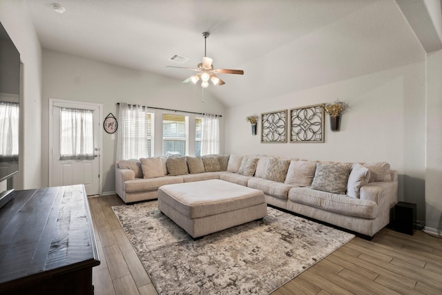 15111 Raffia Leaves Way, Houston, TX 77090 - living area with ceiling fan, wood finished floors, and vaulted ceiling