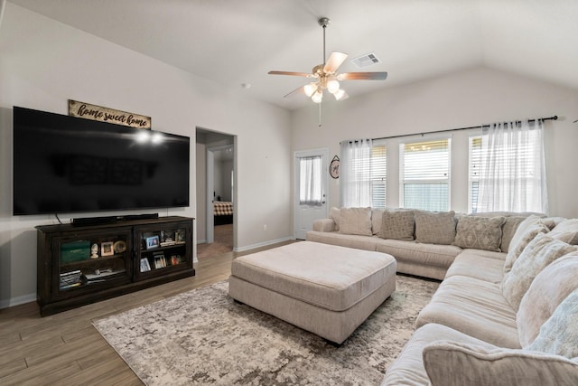 15111 Raffia Leaves Way, Houston, TX 77090 - living room featuring ceiling fan, wood finished floors, lofted ceiling, and baseboards